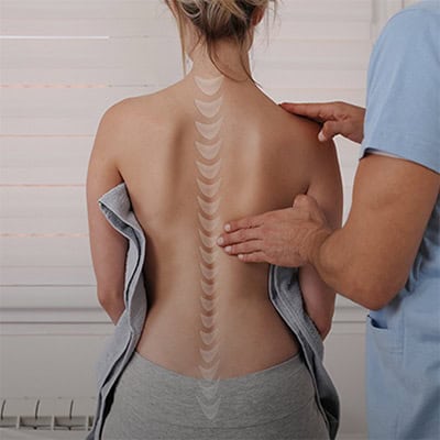 back of woman with transparent image of a spine where the spine would be