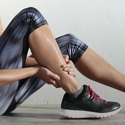 runner holding leg while sitting